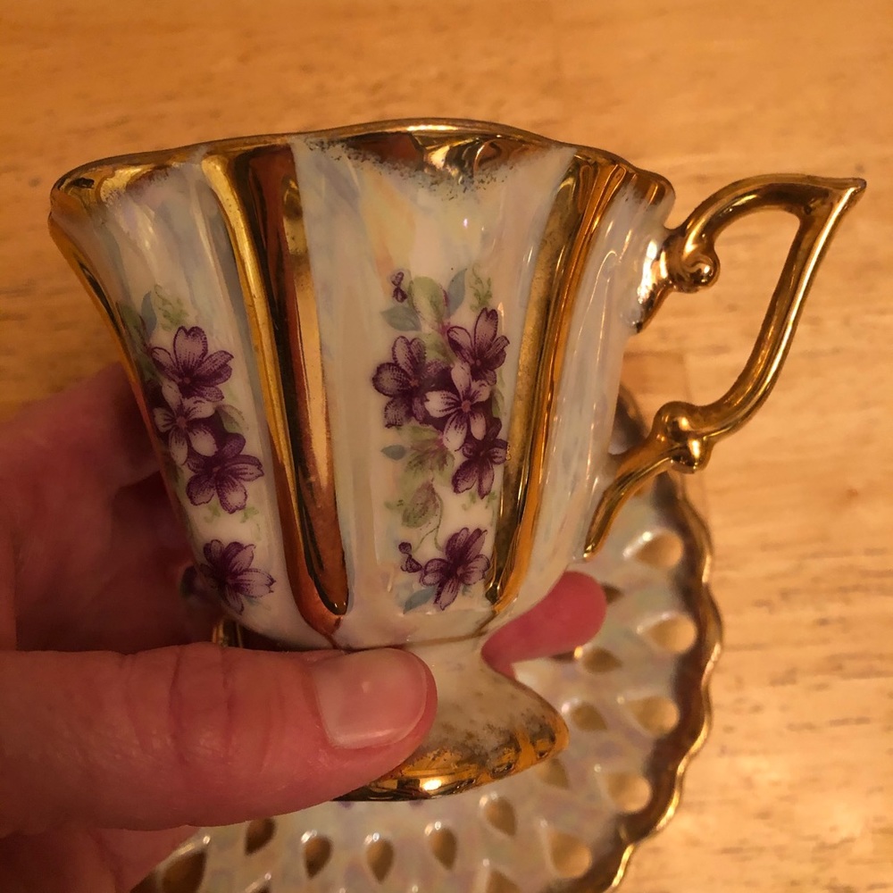Gorgeous vintage tea cup with purple flowers